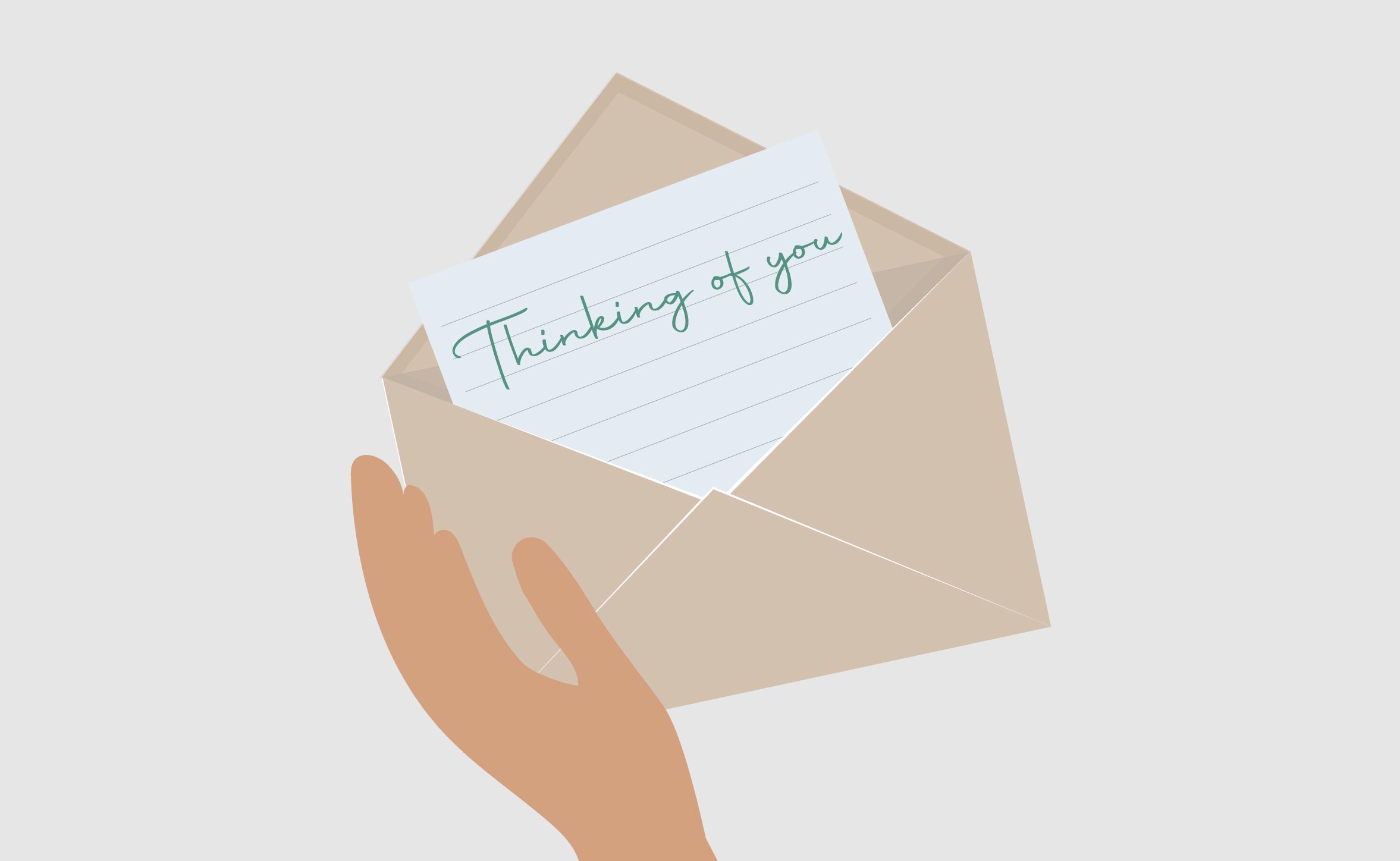 hand holding an envelope that contains a note that reads