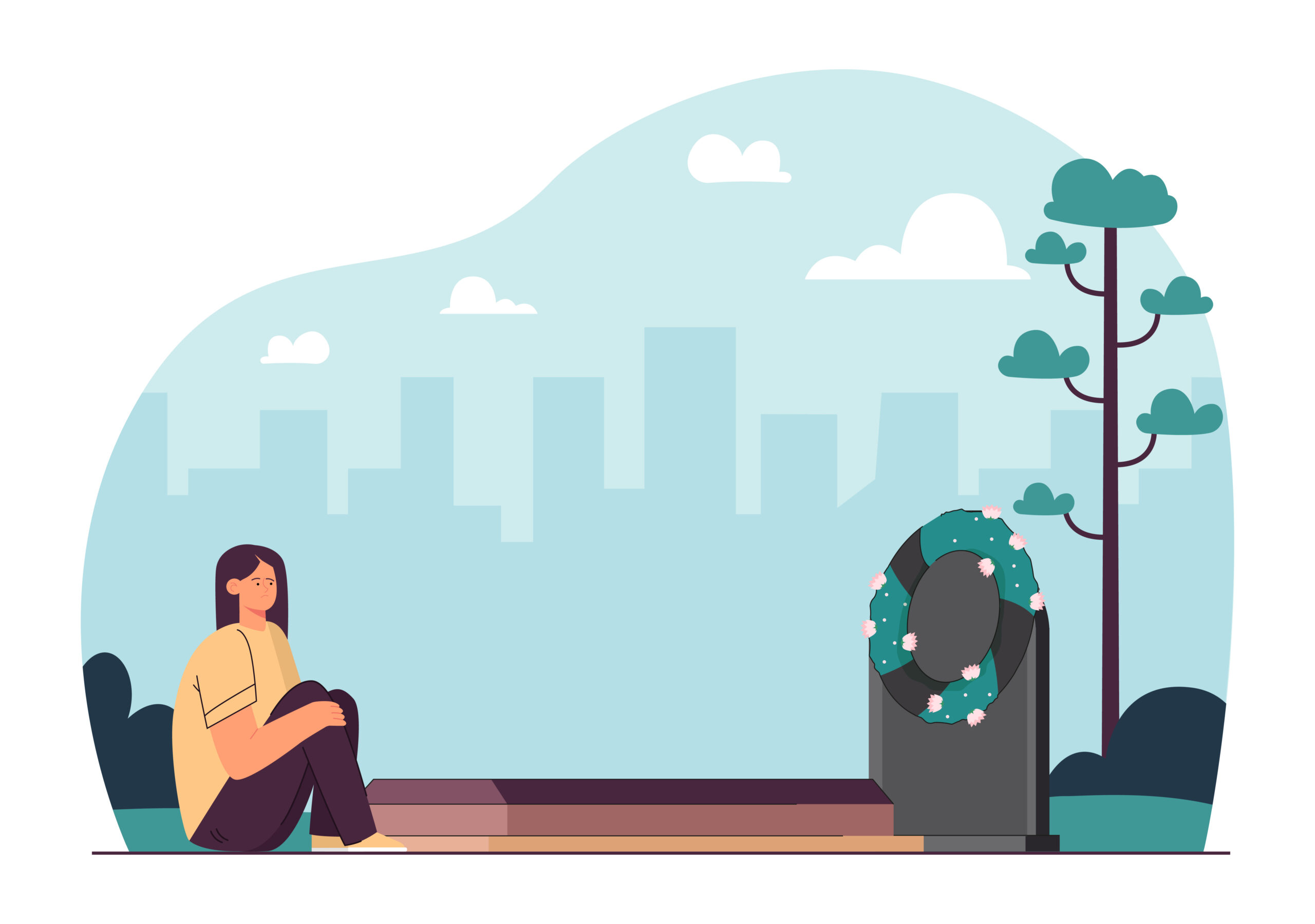 woman sitting at a grave