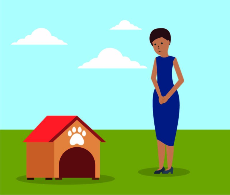 sad woman standing near an empty dog house